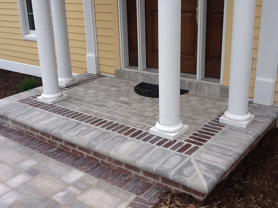 square porch with pillars leading to front door