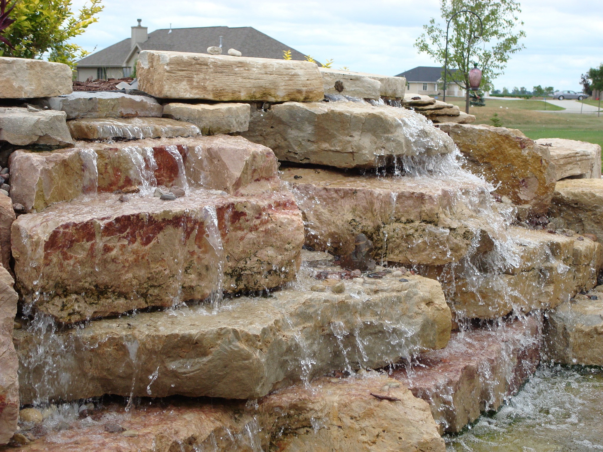 close-up of cascading water feature with stacked stone